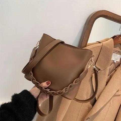 Retro woven PU leather unisex crossbody bucket bag in khaki colour.