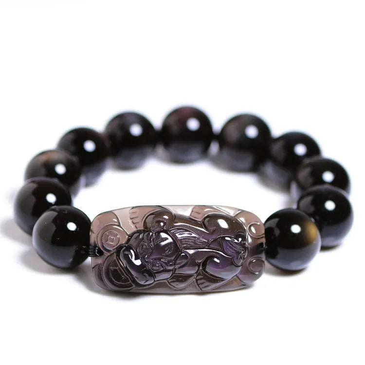 A geometric polished crystal bracelet featuring a Pi Xiu charm on a beaded strand.
