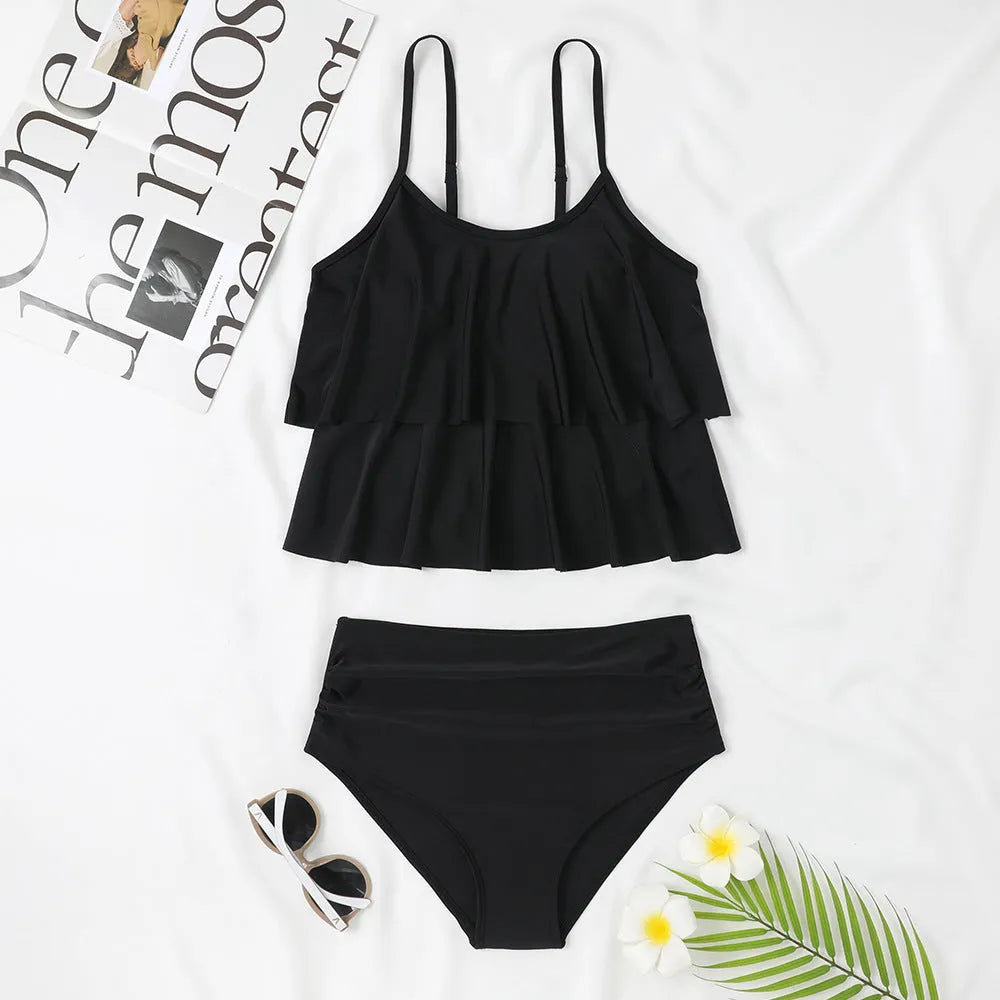 Women's black high-waist two-piece swimsuit with coconut tree print option, shown as a top and briefs set.
