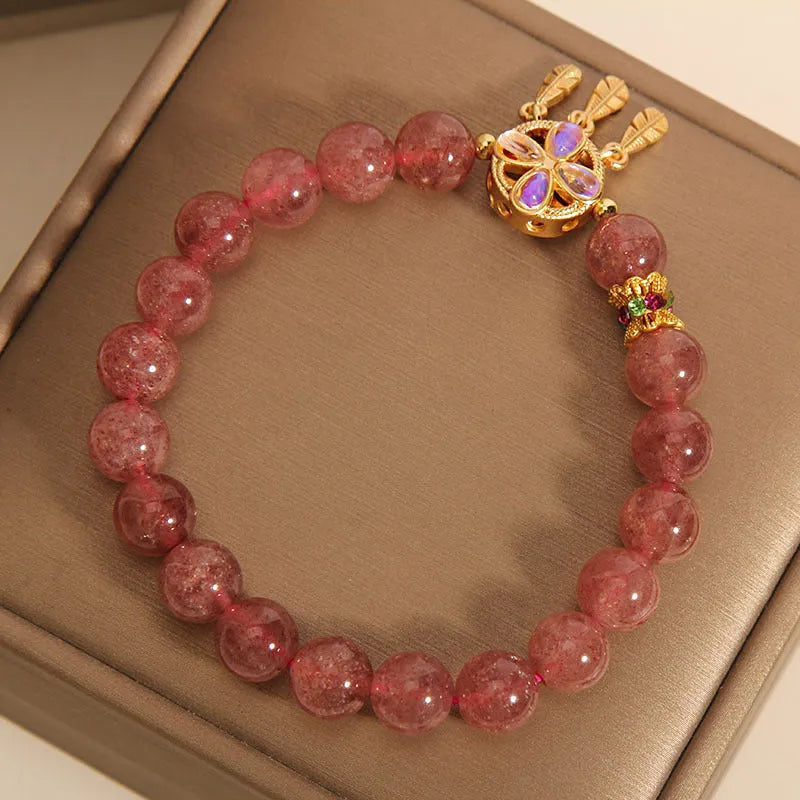 Women's strawberry quartz bracelet with four leaf clover dream catcher ball pendant