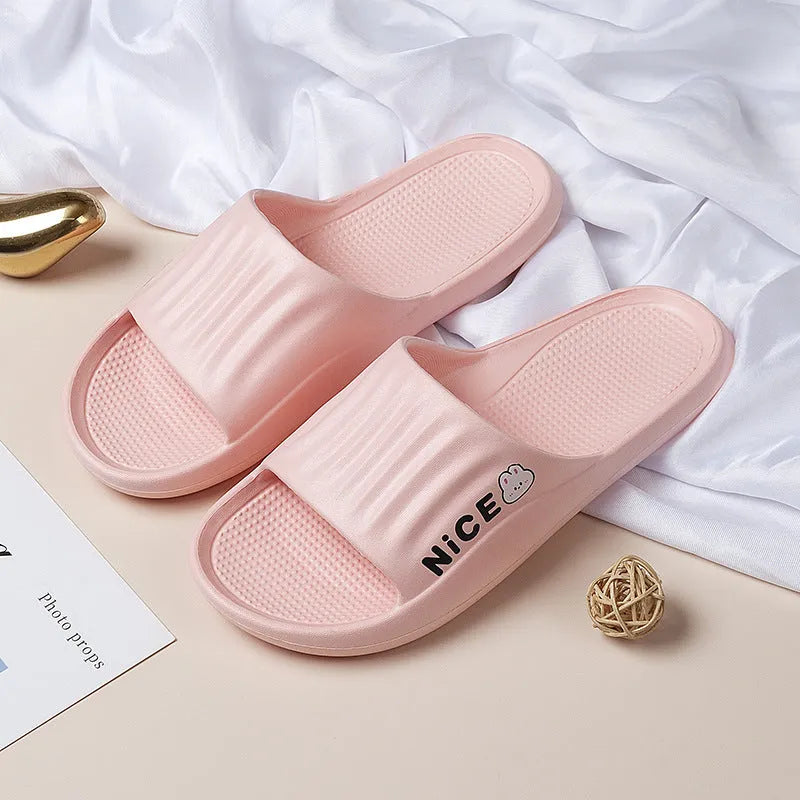 Pair of minimalist EVA flip flop slippers in a choice of six colours, showing the injection moulded non-slip sole.