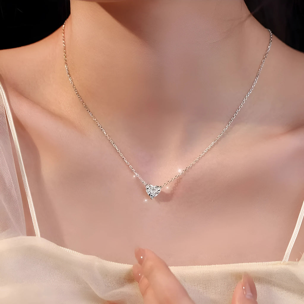 Silver women's necklace with heart-shaped pendant on copper chain