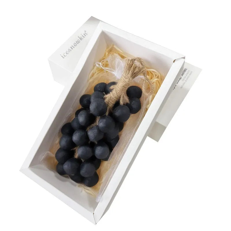 Handmade grape soap bars in black, green, and purple grape scents alongside litchi soap, with gift box and mesh bag packaging