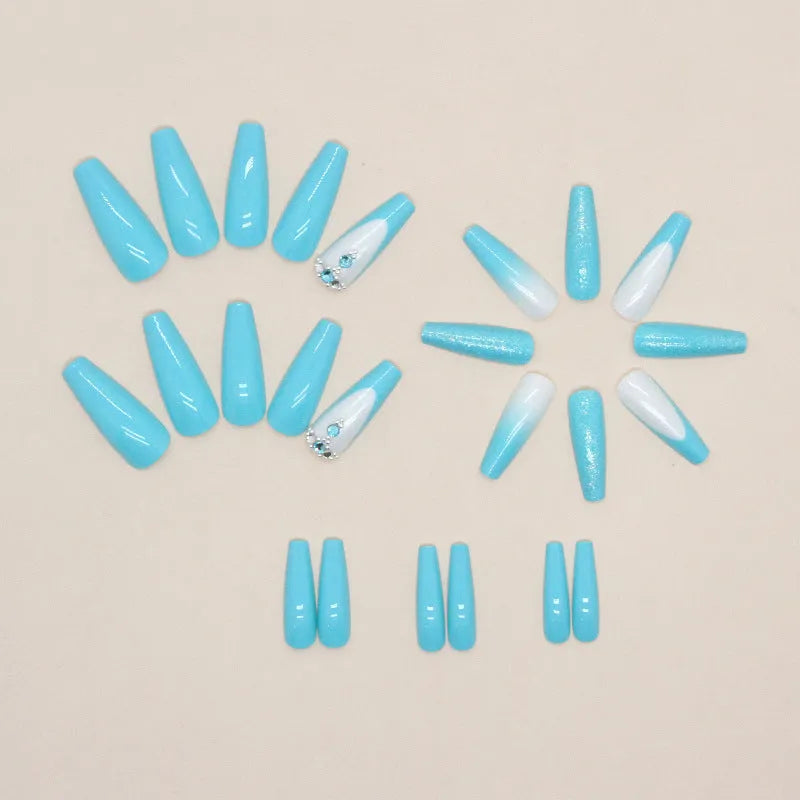 Long ballet shaped false nails in a solid smart blue diamond colour with glue.