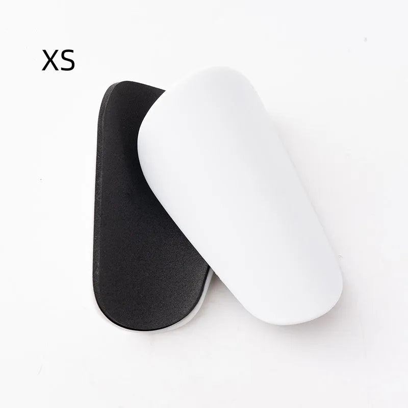 PU mini shin guards for football and sports protection in black, white, red, and blue colours.