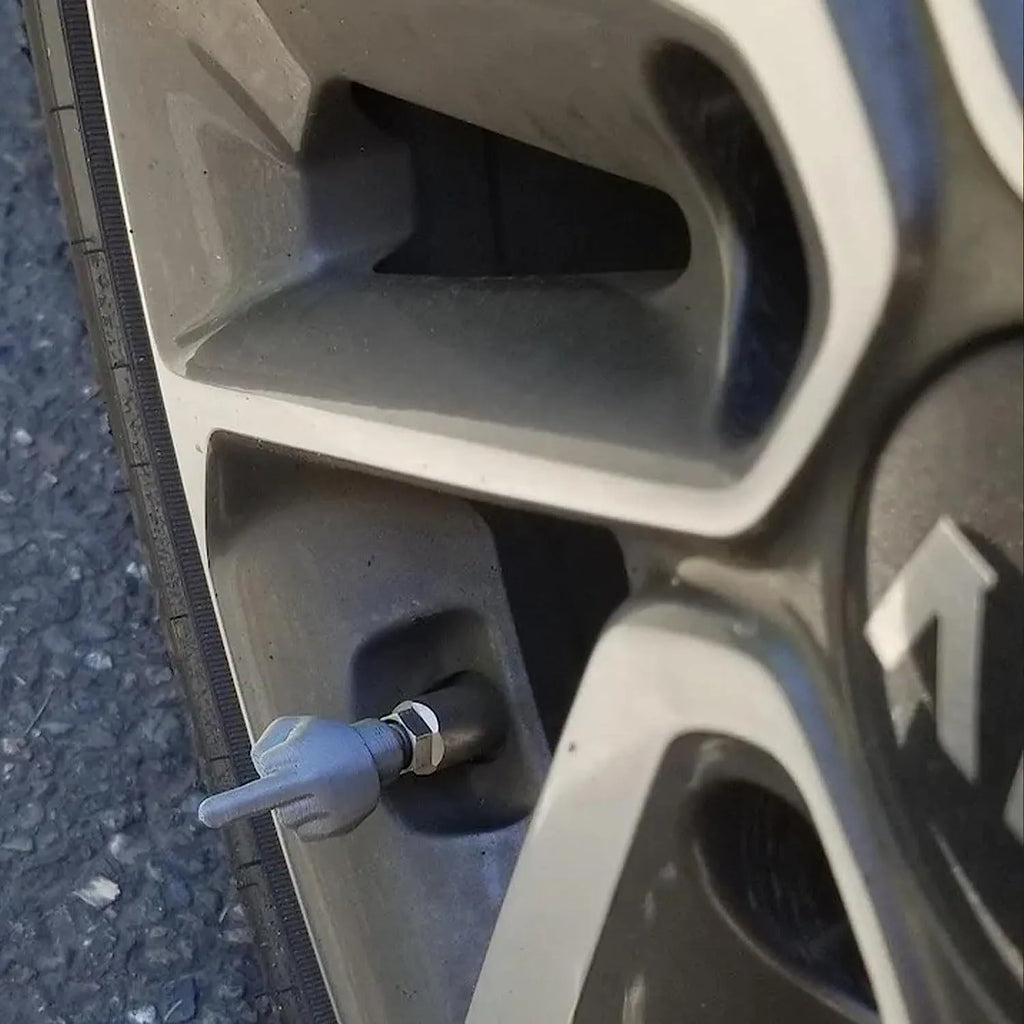 Four latex car tyre valve dust cover caps in black and skin colours