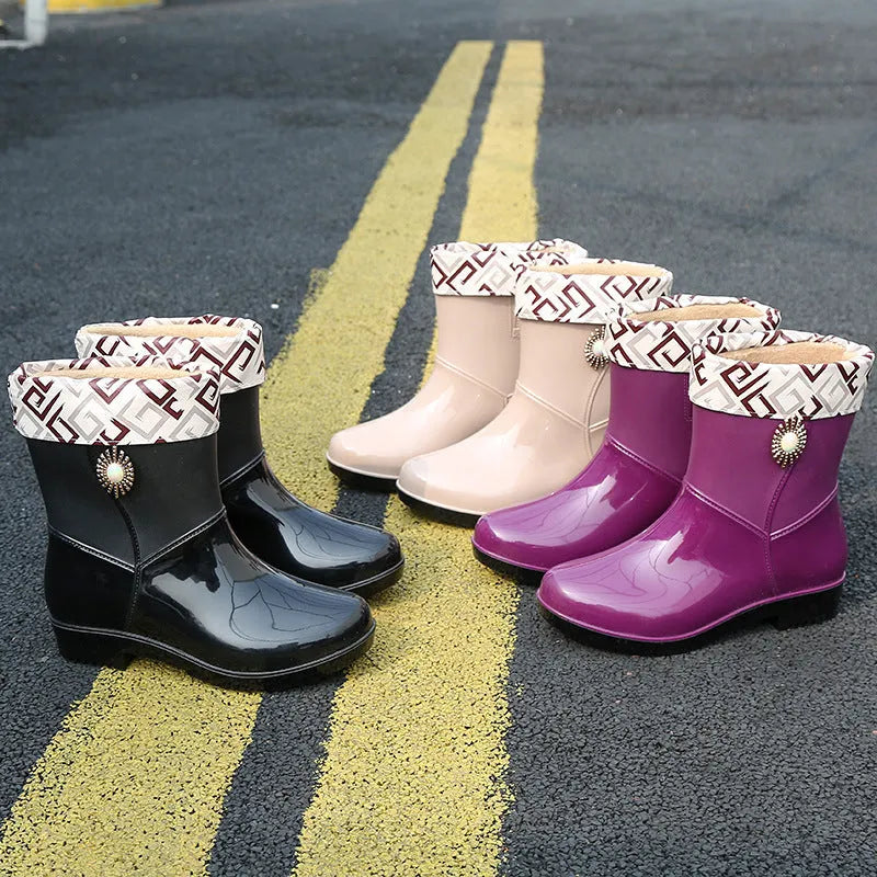 Women's purple PVC rain boots with non-slip sole and middle tube design