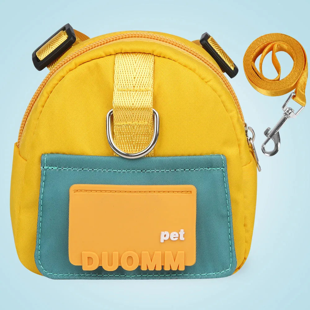 Blue adjustable dog harness backpack with storage compartment and tow rope shown on a medium-sized dog.