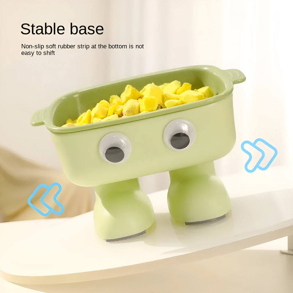 Green robot-shaped elevated cat bowl with tilted design and detachable inner component