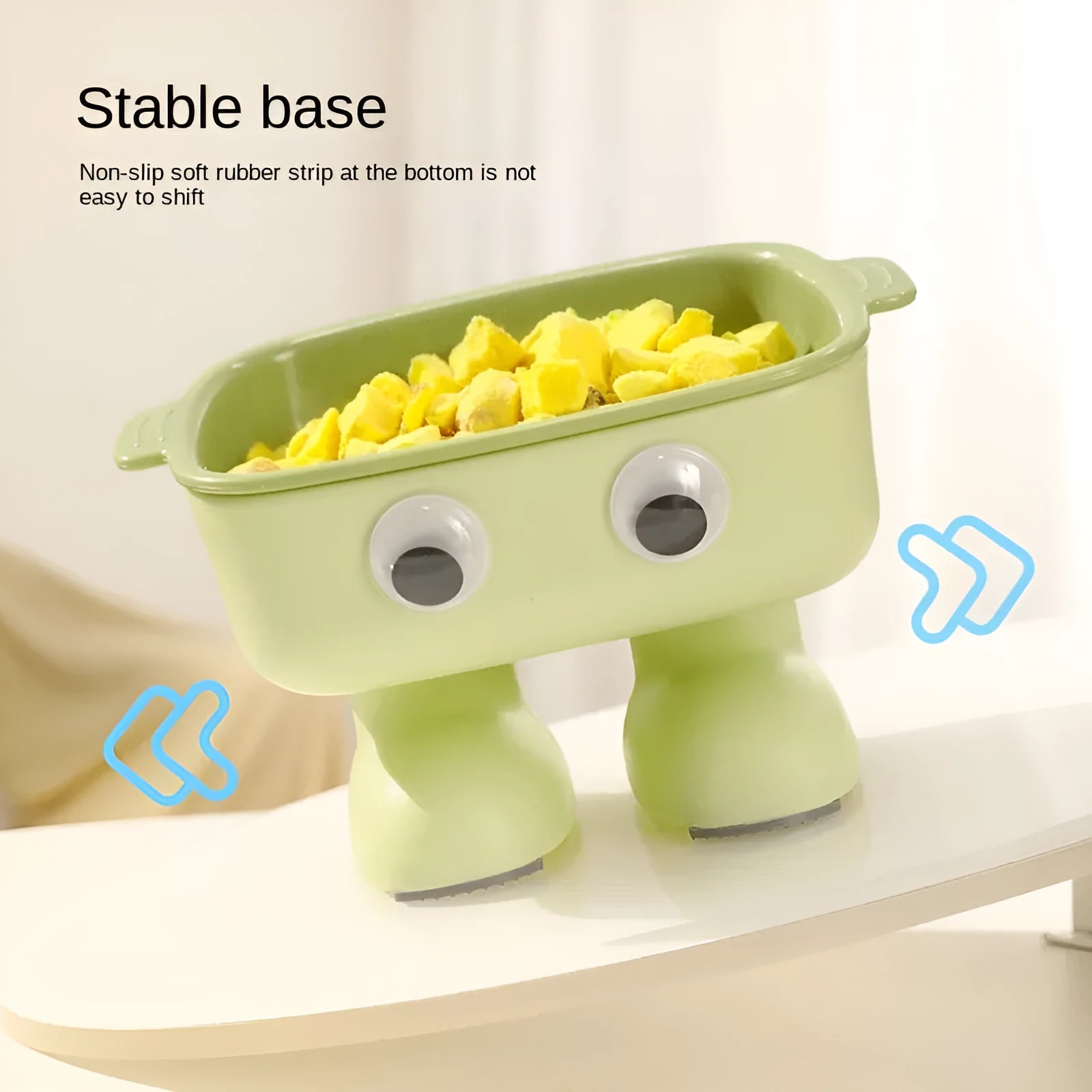 Green robot-shaped elevated cat bowl with tilted design and detachable inner component