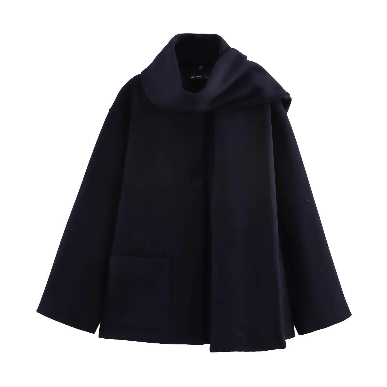 Women's long grey wool blend overcoat with a large artificial fur collar and pockets.