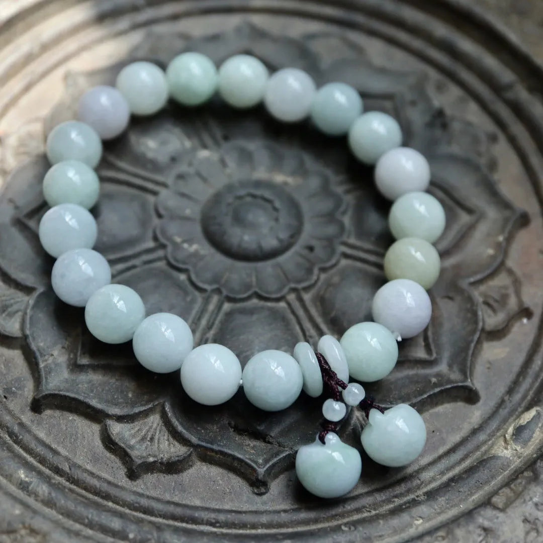 Natural jade geometric bracelet with hanging charm showing Apple design option