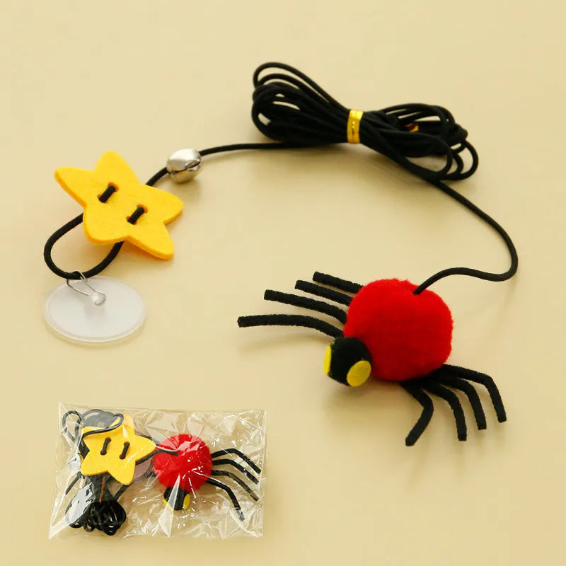 Cat hanging door toy with red feather and bell spider dangling from elastic rope