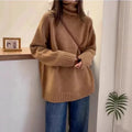 Women's loose-fit turtleneck sweater with thick curling pile collar in black, camel, grey, or red.