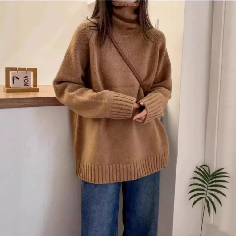 Women's loose-fit turtleneck sweater with thick curling pile collar in black, camel, grey, or red.