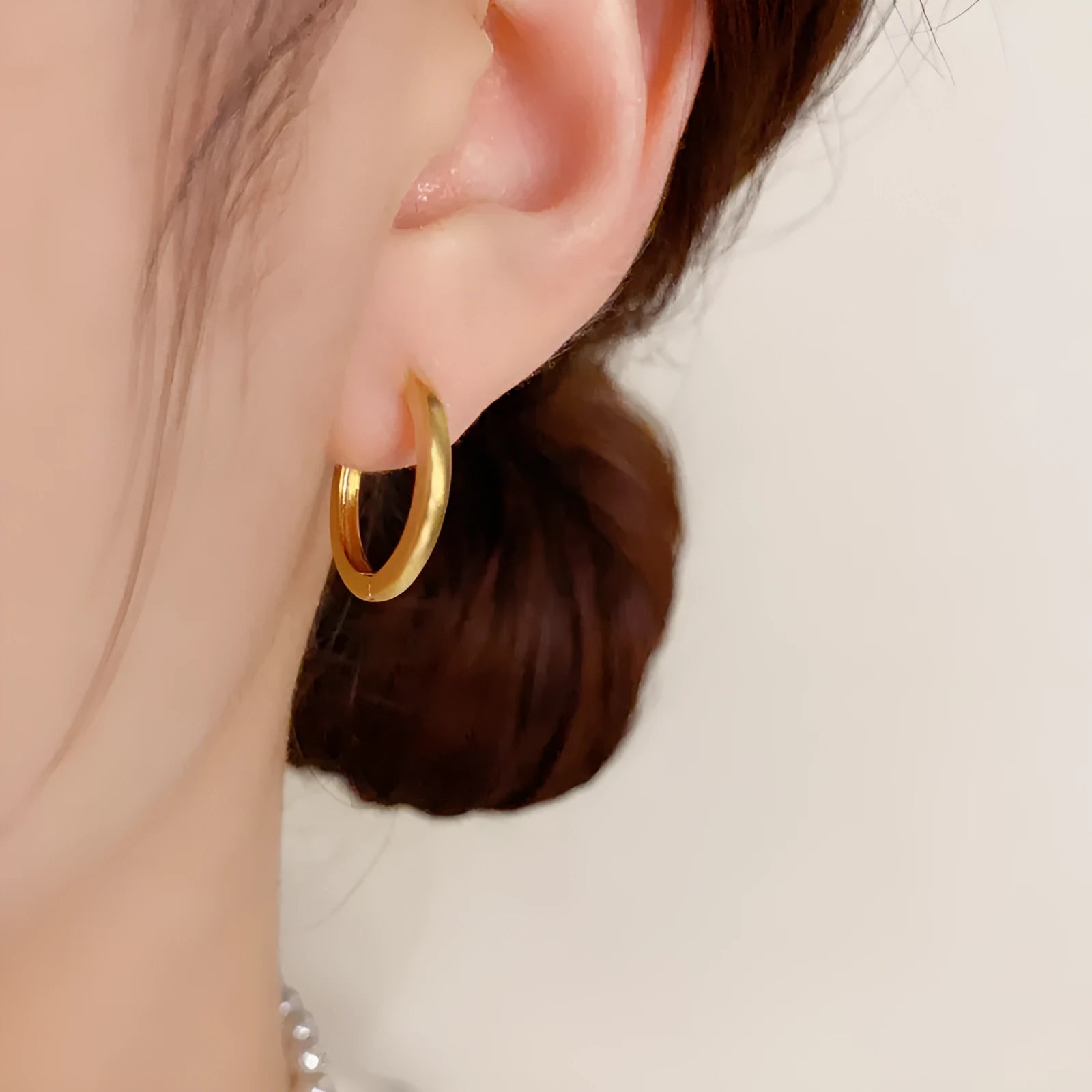 Geometric round ear clip jewellery with gold plating in minimalist style