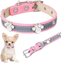 Adjustable leather dog collar with reflective stitching and metal paw print rivets