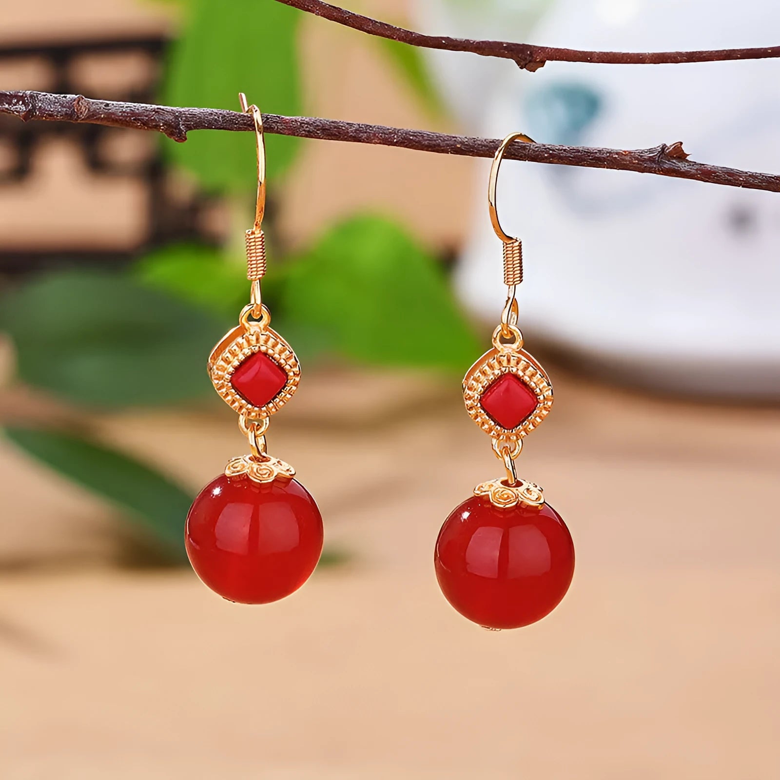 Geometric copper earrings with red agate beads and electroplated silver detailing