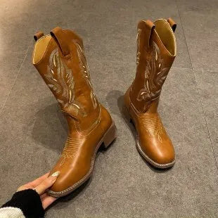 Brown women's mid-calf Martin boots with embroidered pattern, leather lining, and a square rubber sole.