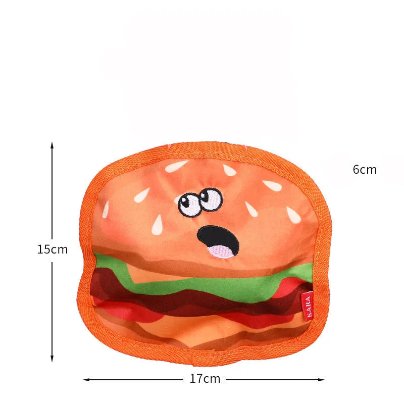 Food-shaped dog chew toys including hamburger, fries, hot dog and pizza designs with crinkle and squeak features