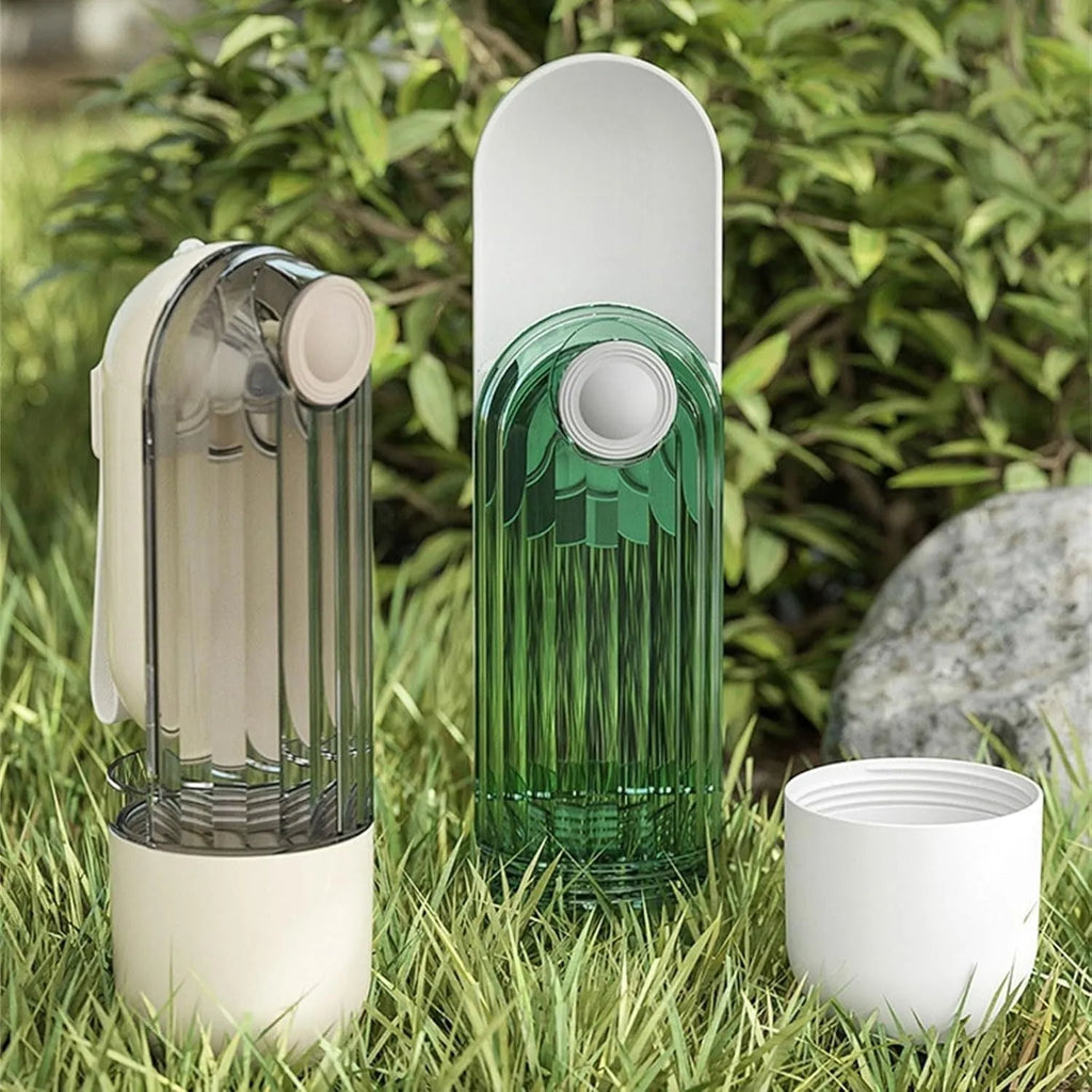 Beige foldable dog water bottle and food dispenser with tray, shown next to a dog on a walk.