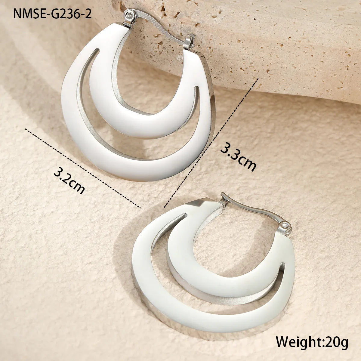 Geometric gold plated hoop earrings with round ring design on stainless steel background