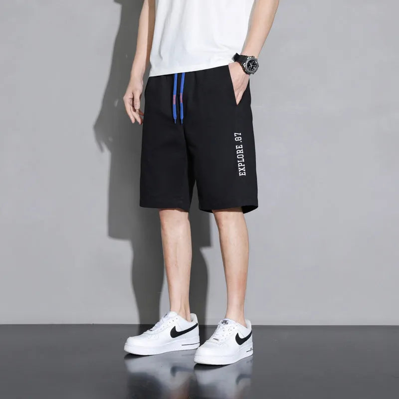 Boys' cotton summer shorts in sporty style available in black, khaki, and white colours