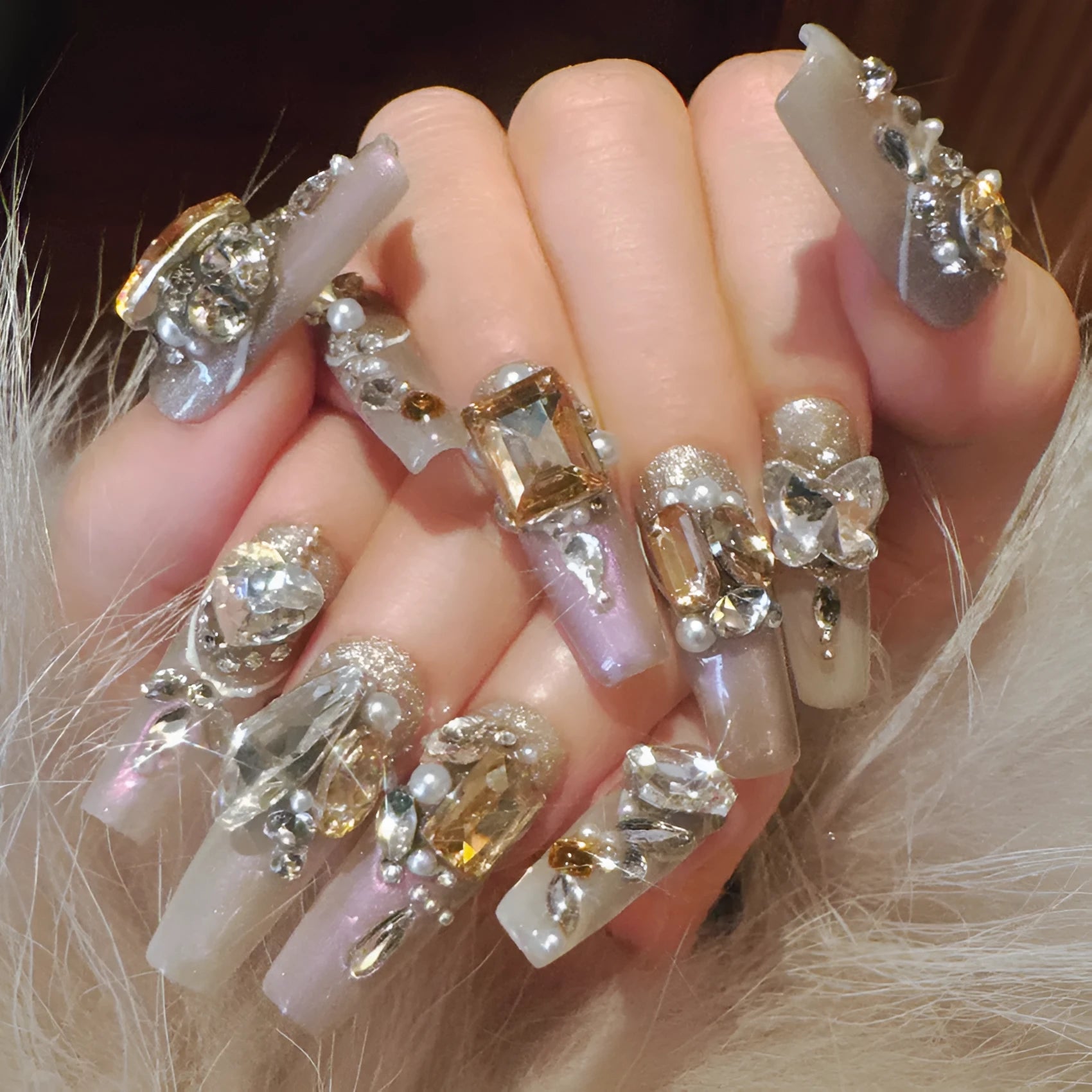 Rhinestone-decorated false nail patches on card packaging with application adhesive and tools