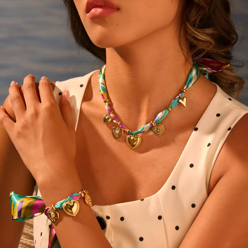 Women's stainless steel necklace or bracelet with 18K gold plating and geometric pendant design