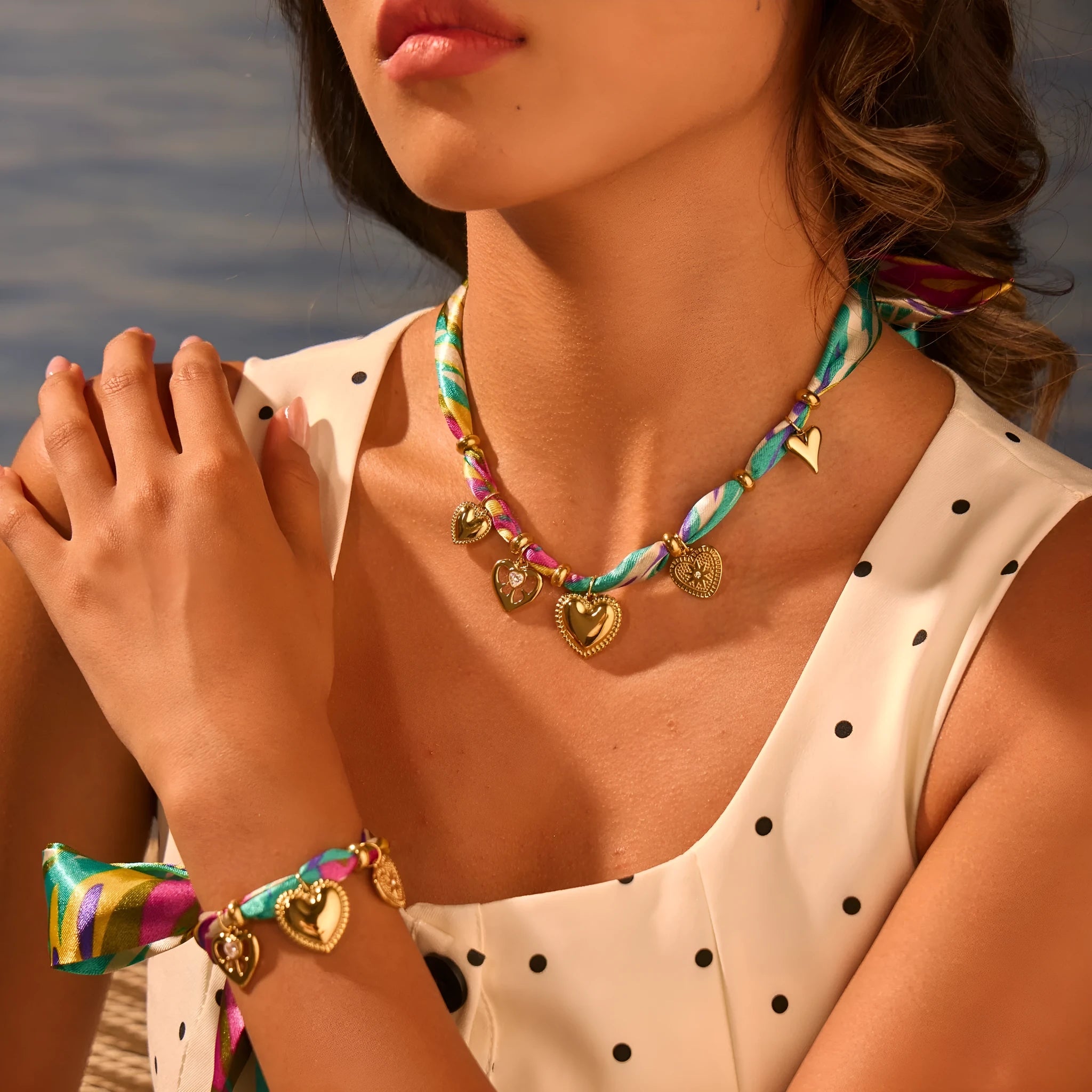 Women's stainless steel necklace or bracelet with 18K gold plating and geometric pendant design