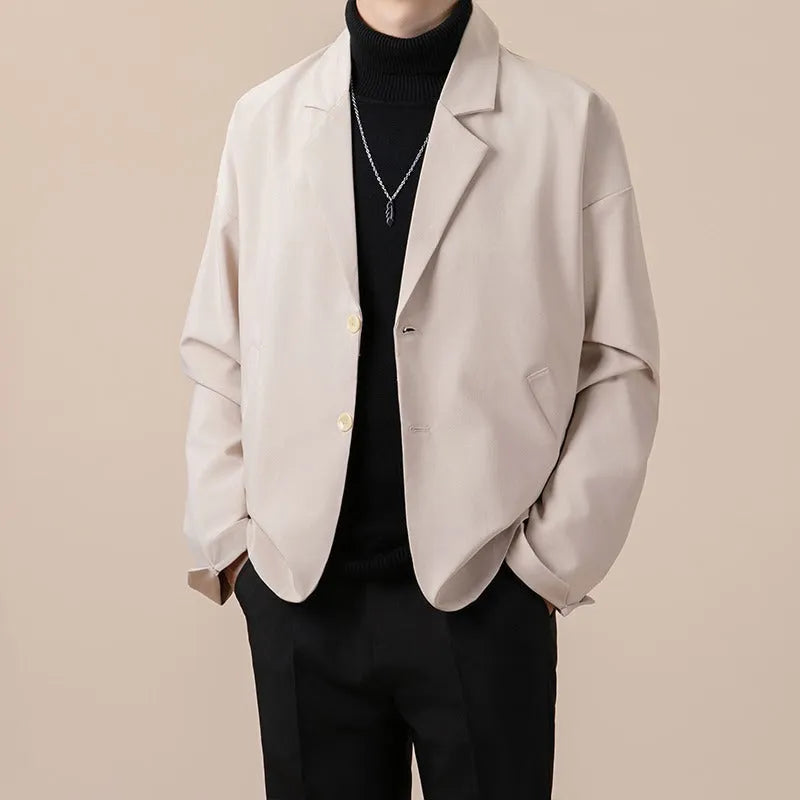 Man wearing a loose fit casual suit jacket in a light business style, available in apricot colour.