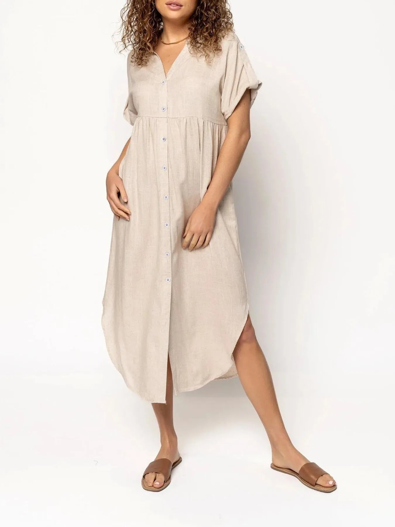 Women's loose-fit mid-length casual dress with button front in a solid colour.