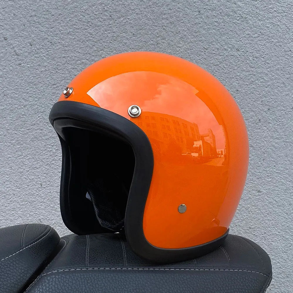 Glass fibre retro half motorcycle helmet shown in multiple colour options including cement grey and matte black flower patterns
