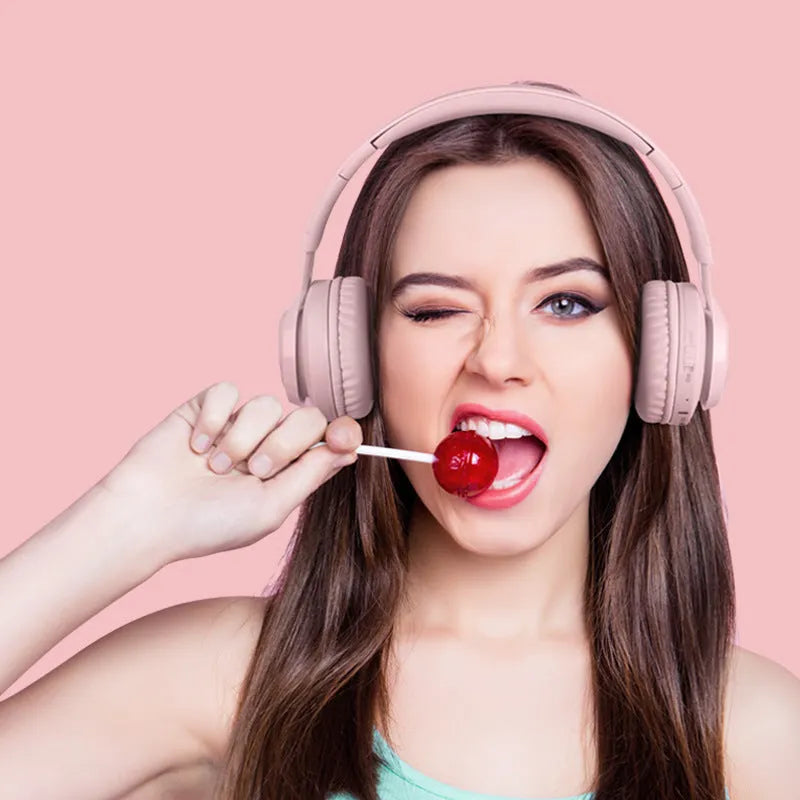 Wireless RGB LED headphones for children in bunny pink with lights illuminated