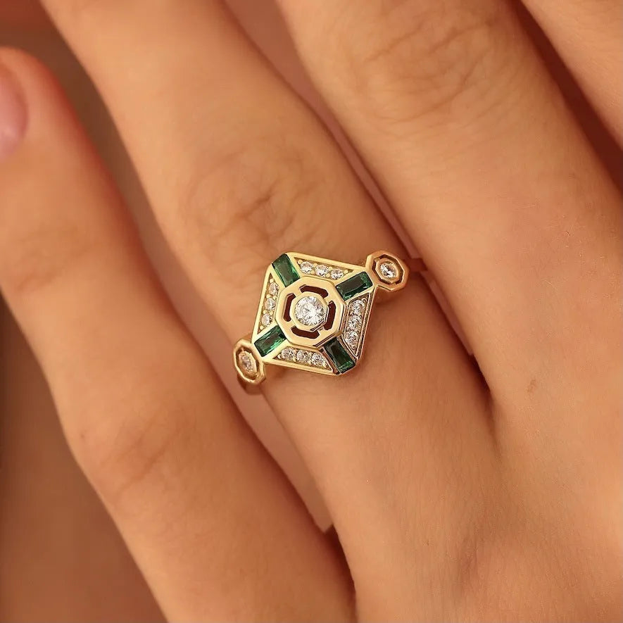 A square-cut Ins style emerald diamond ring for women on a white background.