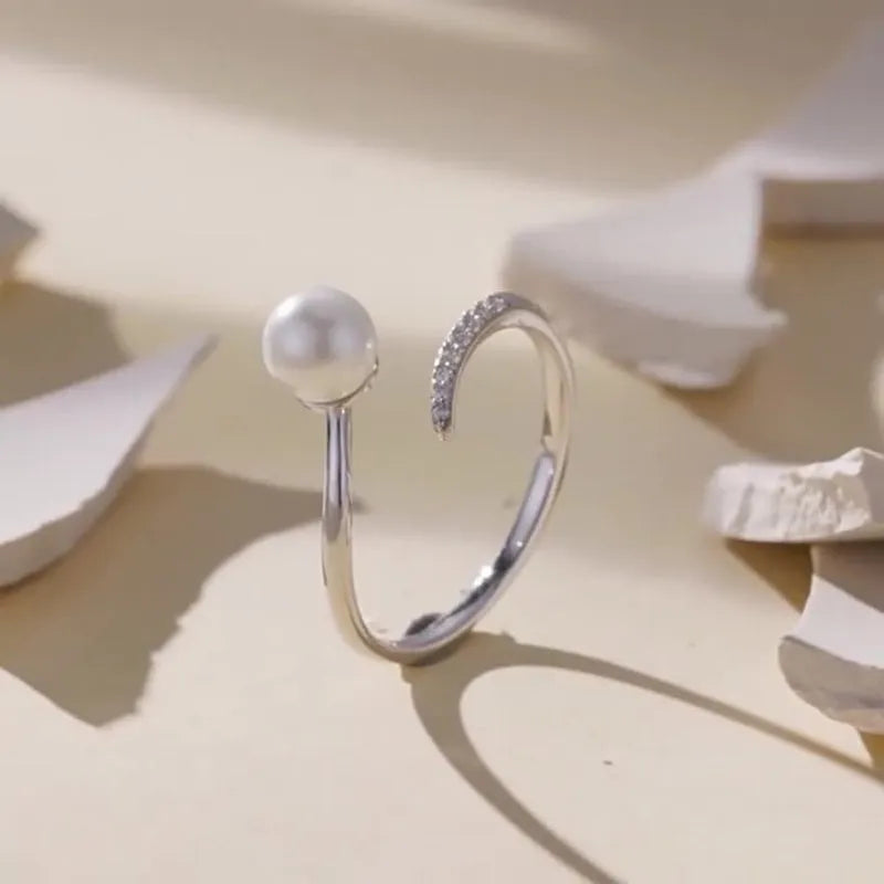 Women's S925 sterling silver adjustable ring with pearl detail and open loop design