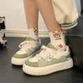 Green women's casual shoes with mesh upper, round toe, and flat heel design