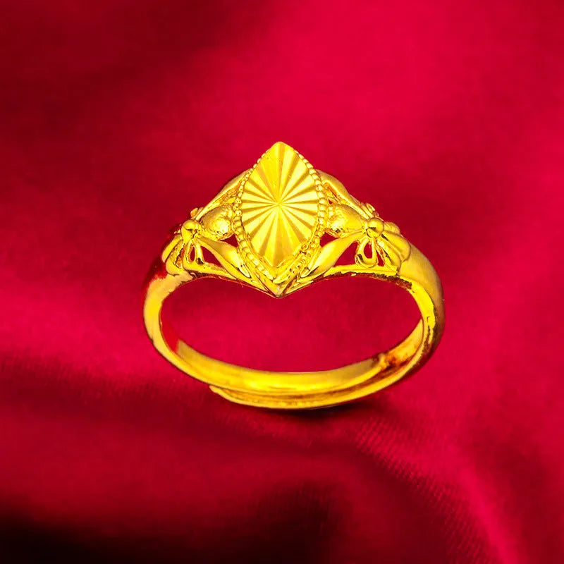 Gold geometric ring with open diamond floral pattern and textured surface