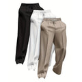 Pack of three men's solid colour loose-fit corduroy trousers on a hanger.