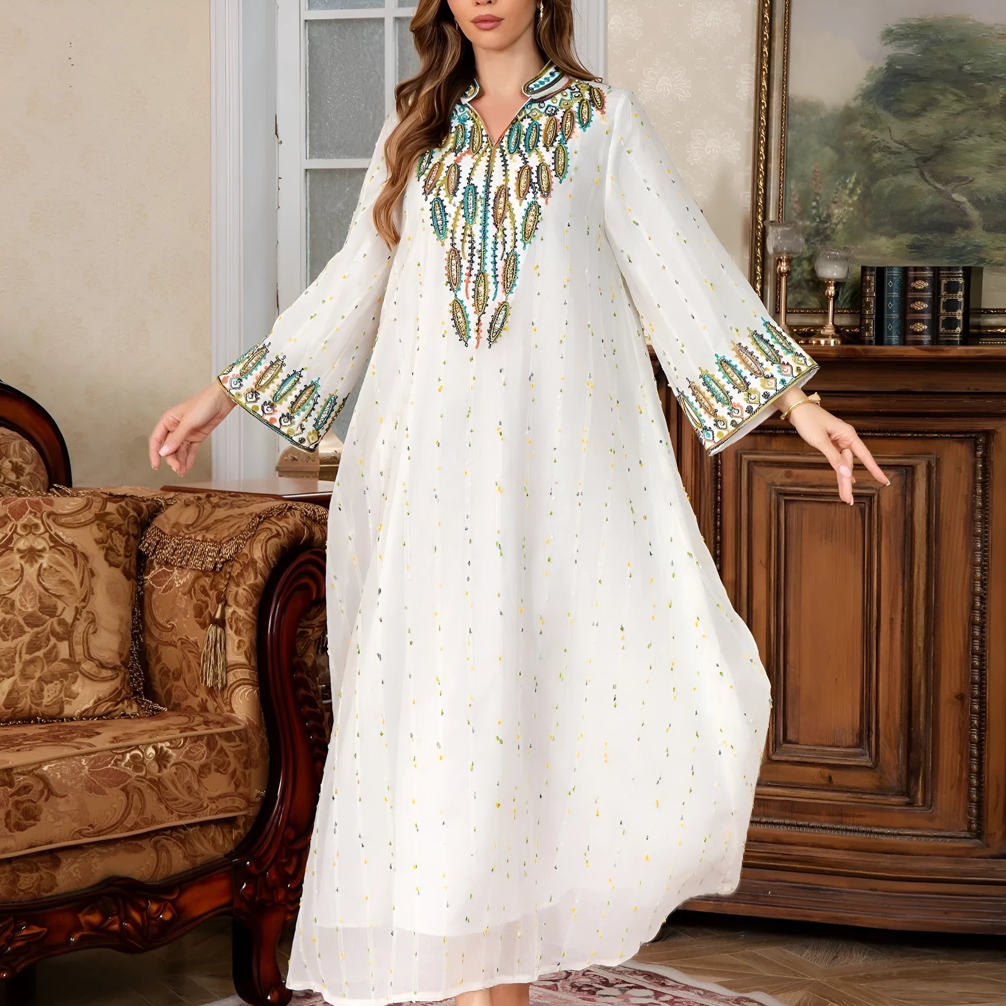 White long sleeve, long skirt Arabic robe for women on a hanger.