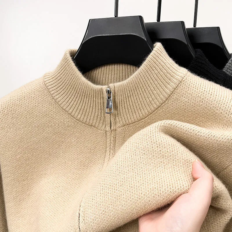 Men's loose grey knitted cardigan with a stand collar and a front zipper.