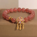Women's strawberry quartz bracelet with four leaf clover dream catcher ball pendant
