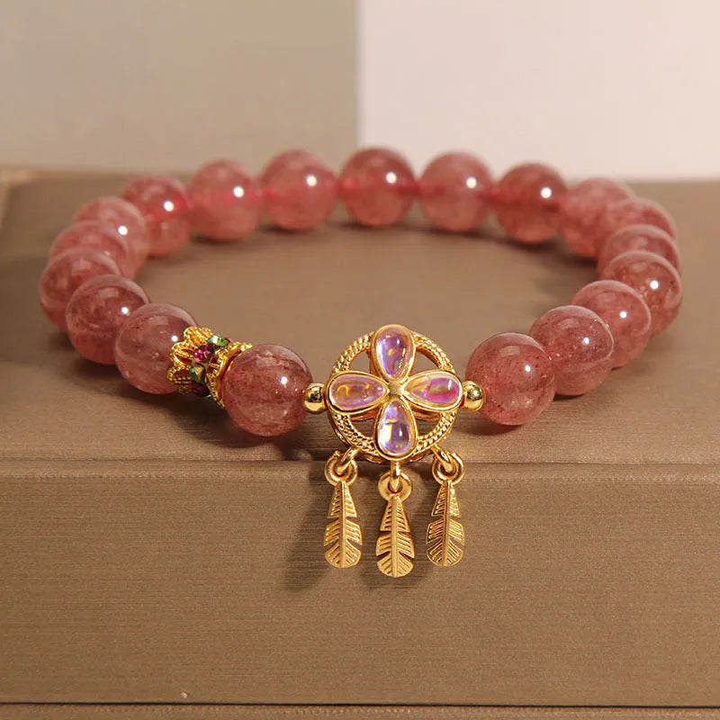 Women's strawberry quartz bracelet with four leaf clover dream catcher ball pendant