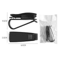 Black plastic clip for car sun visor holding a pair of glasses and a ticket.