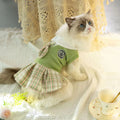 A tartan skirt for small pets in pink, blue, or green, made from polyester fabric.