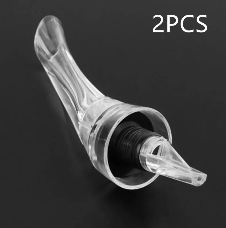 Clear acrylic wine aerator with stainless steel filter, measuring 16cm long.