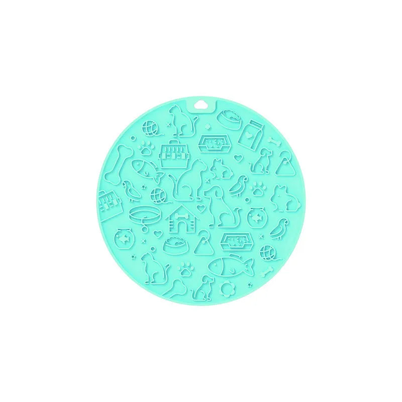Round silicone pet licking mat with suction cup base in blue colour on smooth surface