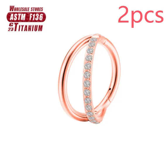 Titanium alloy fork nose ring in silver colour on a plain background, showing its shape and size.