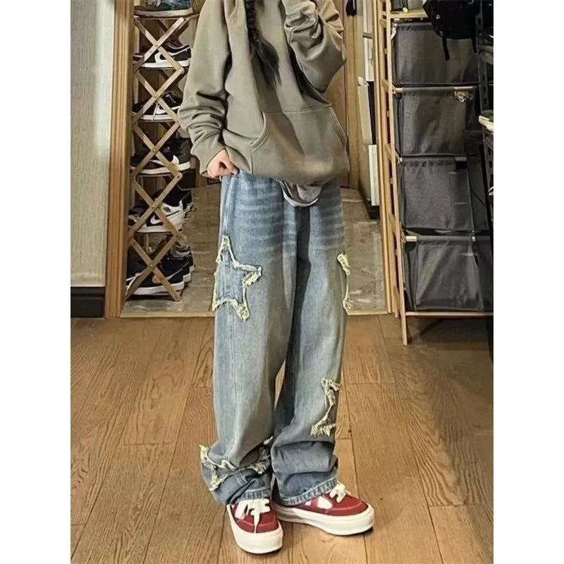 Blue women's cotton denim wide-leg trousers with a high waist on a size chart.