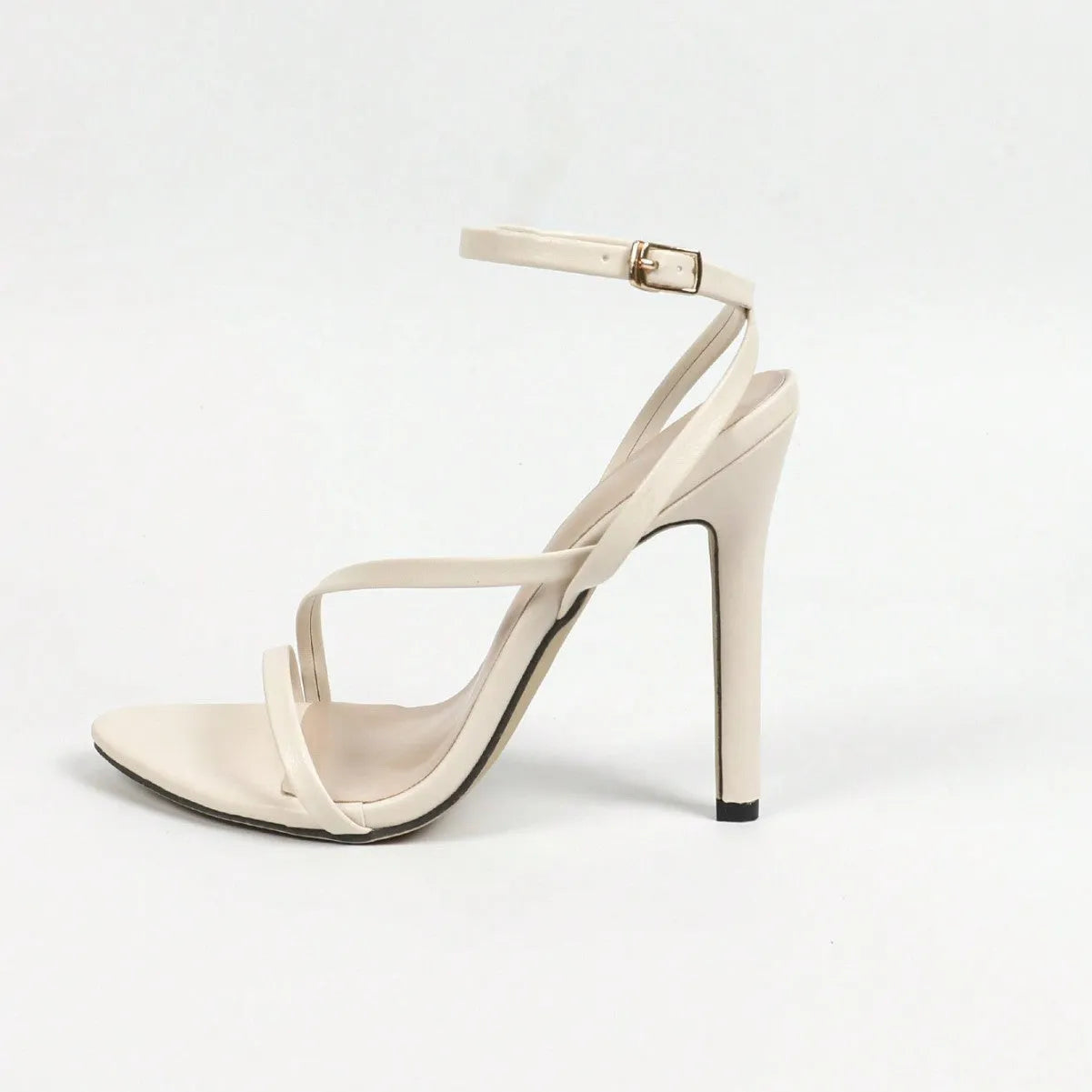 Gold women's high heels with a cross strap around the ankle and an open round toe.